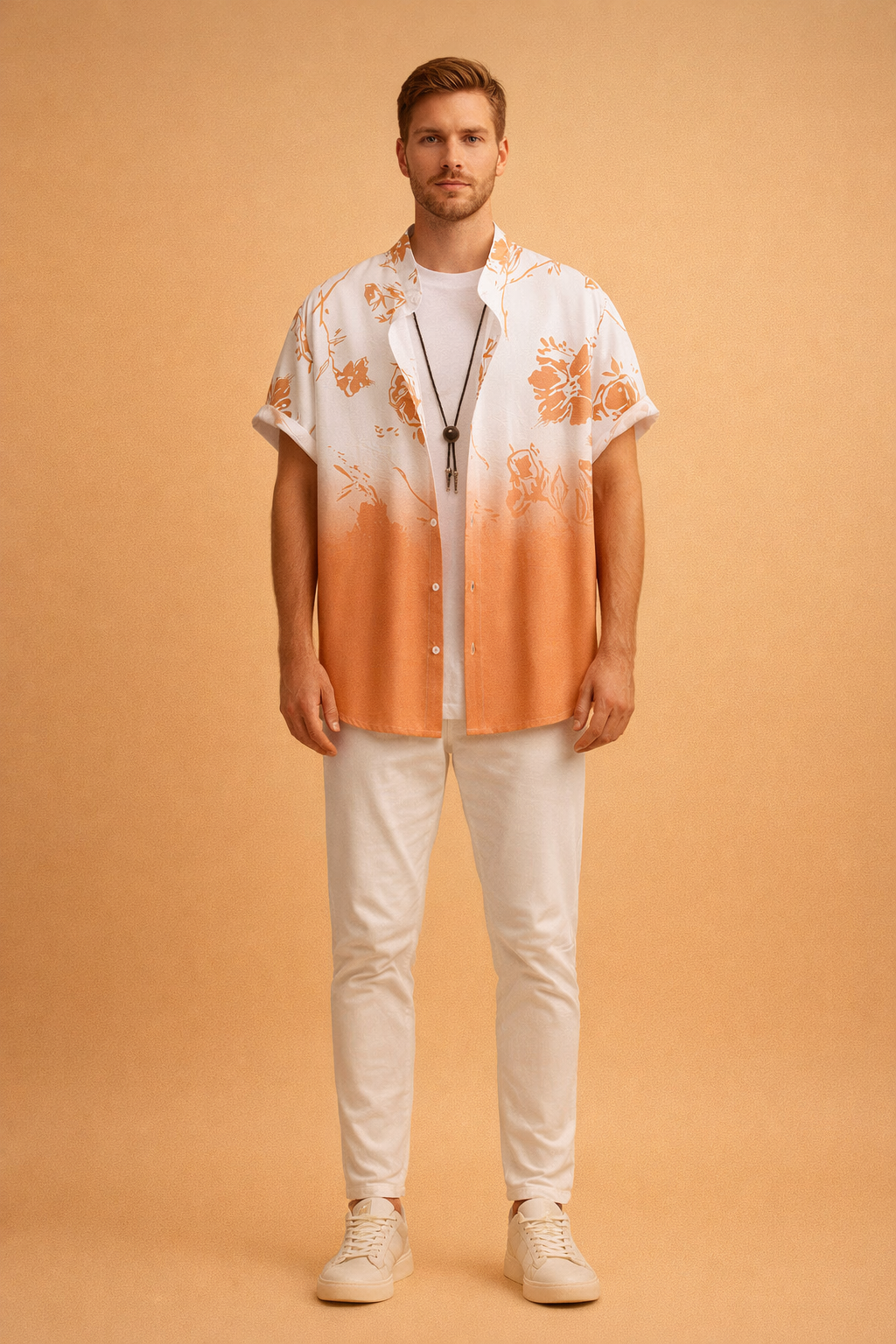 Short-sleeve button-up shirt with an identical white-to-warm orange gradient and floral print pattern, featuring rolled cuffs and a relaxed drape, layered over a clean white crew-neck T-shirt, styled with slim-fit white trousers, minimal white low-top sneakers, and a simple dark pendant necklace for a refined casual summer look.