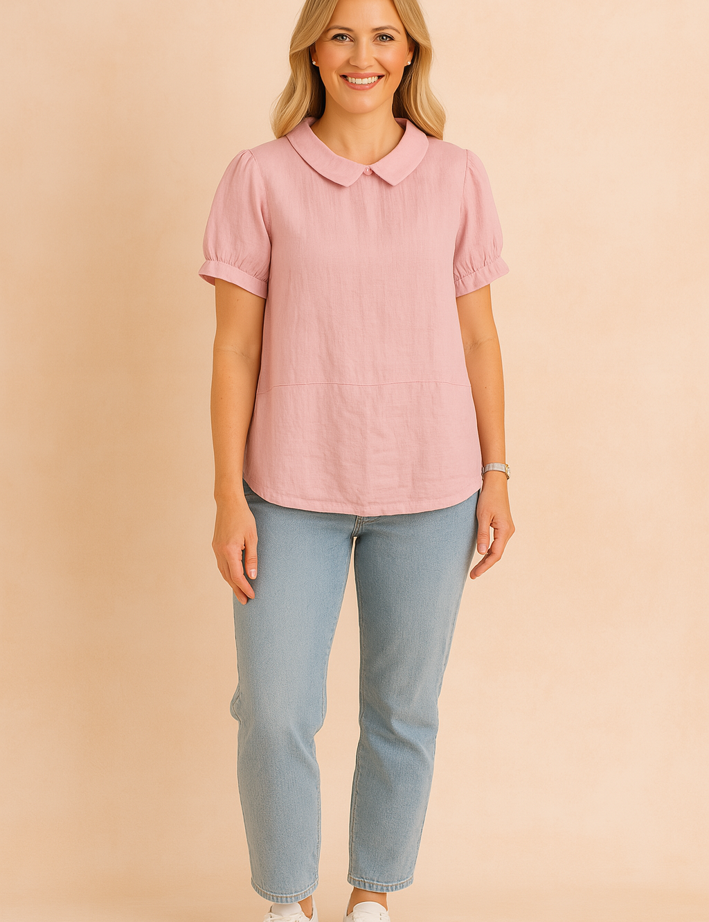 Pastel pink linen blouse with Peter Pan collar and short puff sleeves, styled with light blue jeans and white sneakers