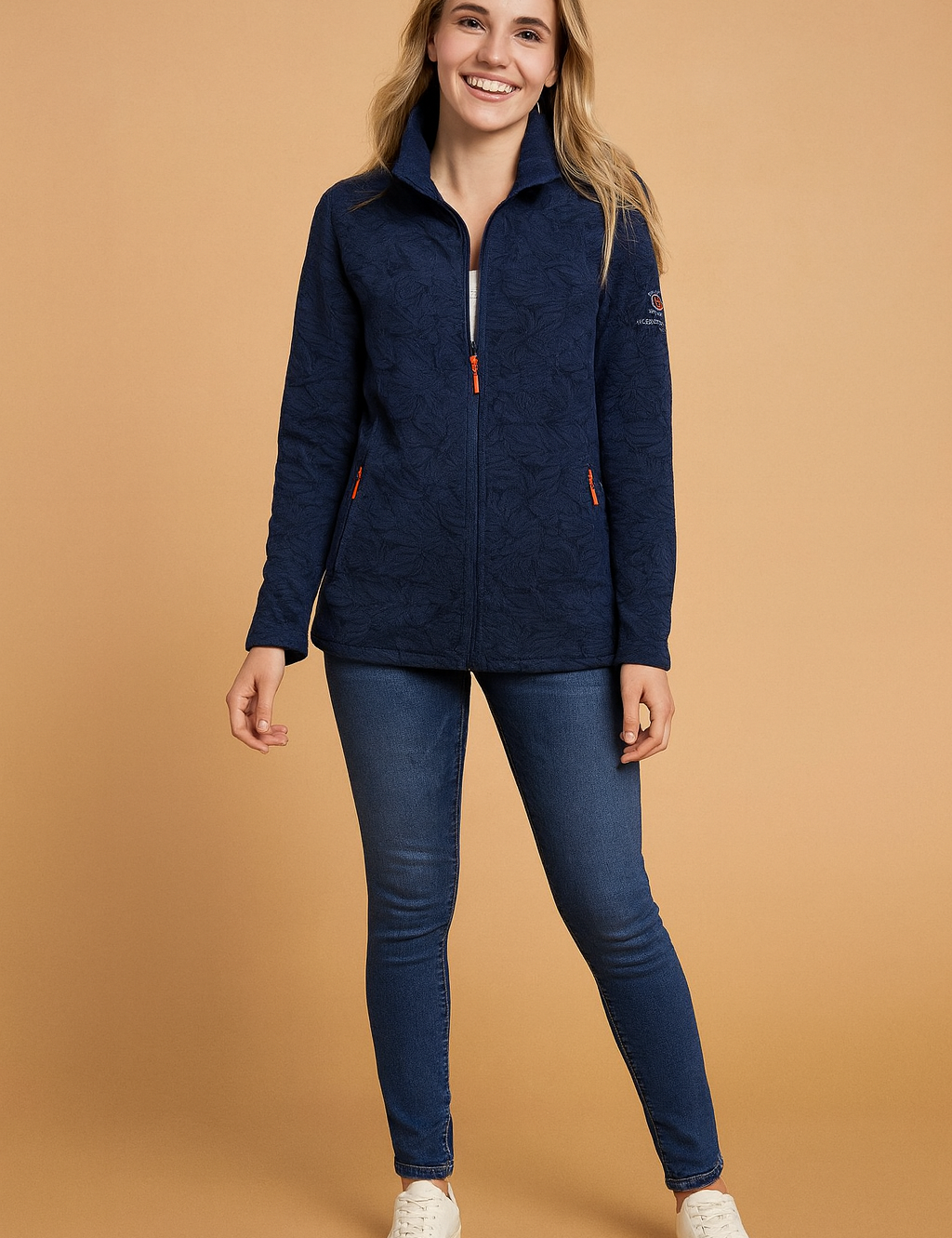 Navy blue fleece jacket with zip closure, subtle leaf-patterned texture, and embroidered arm detail.