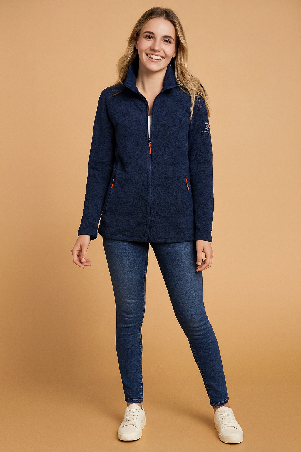 Navy blue fleece jacket with zip closure, subtle leaf-patterned texture, and embroidered arm detail.