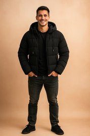 Stylish black puffer jacket with quilted pattern, full-length zipper, and dual front pockets, designed for warmth and urban versatility.