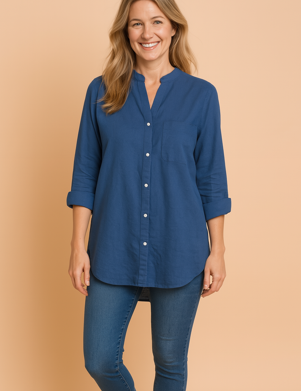 Relaxed-fit mandarin collar long-sleeve shirt in solid deep blue, featuring a front patch pocket, button-down closure, and soft cotton texture.