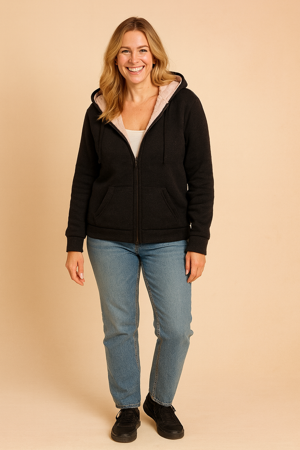 black  zip-front hoodie with beige fleece lining, ribbed cuffs and hem, and front kangaroo pockets, made from soft brushed fabric.