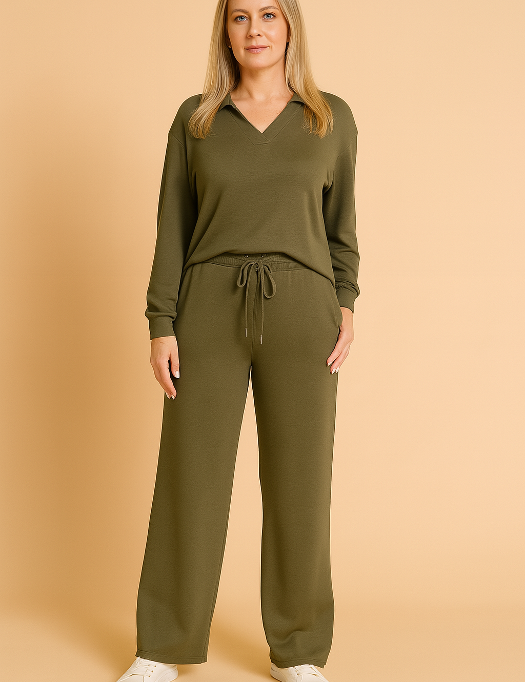 Two-piece army green loungewear set featuring a long-sleeve V-neck top with a collar detail and matching wide-leg drawstring pants, styled with white sneakers.