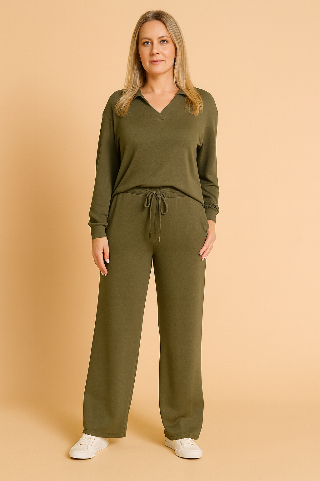 Two-piece army green loungewear set featuring a long-sleeve V-neck top with a collar detail and matching wide-leg drawstring pants, styled with white sneakers.