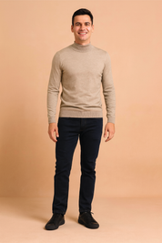 Beige knit turtleneck sweater with fine ribbed texture, long sleeves, and a fitted cut for a sleek and minimal look.