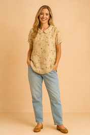 Beige linen short-sleeve blouse with peter pan collar, featuring a delicate red and green floral vine embroidery design.