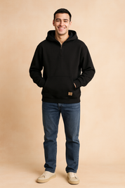 Men’s casual black half-zip hoodie with front pocket and relaxed fit, styled with classic ribbed cuffs and hem for a modern streetwear look.