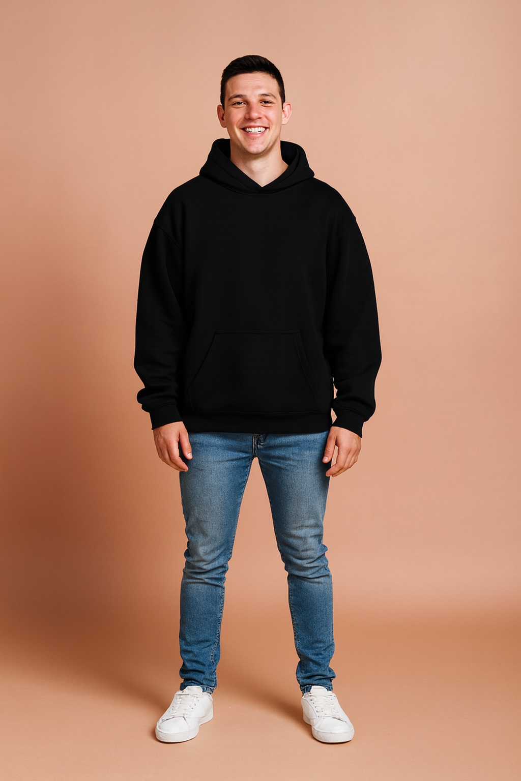 Black pullover hoodie with front kangaroo pocket, ribbed cuffs and hem, and relaxed fit for casual wear.