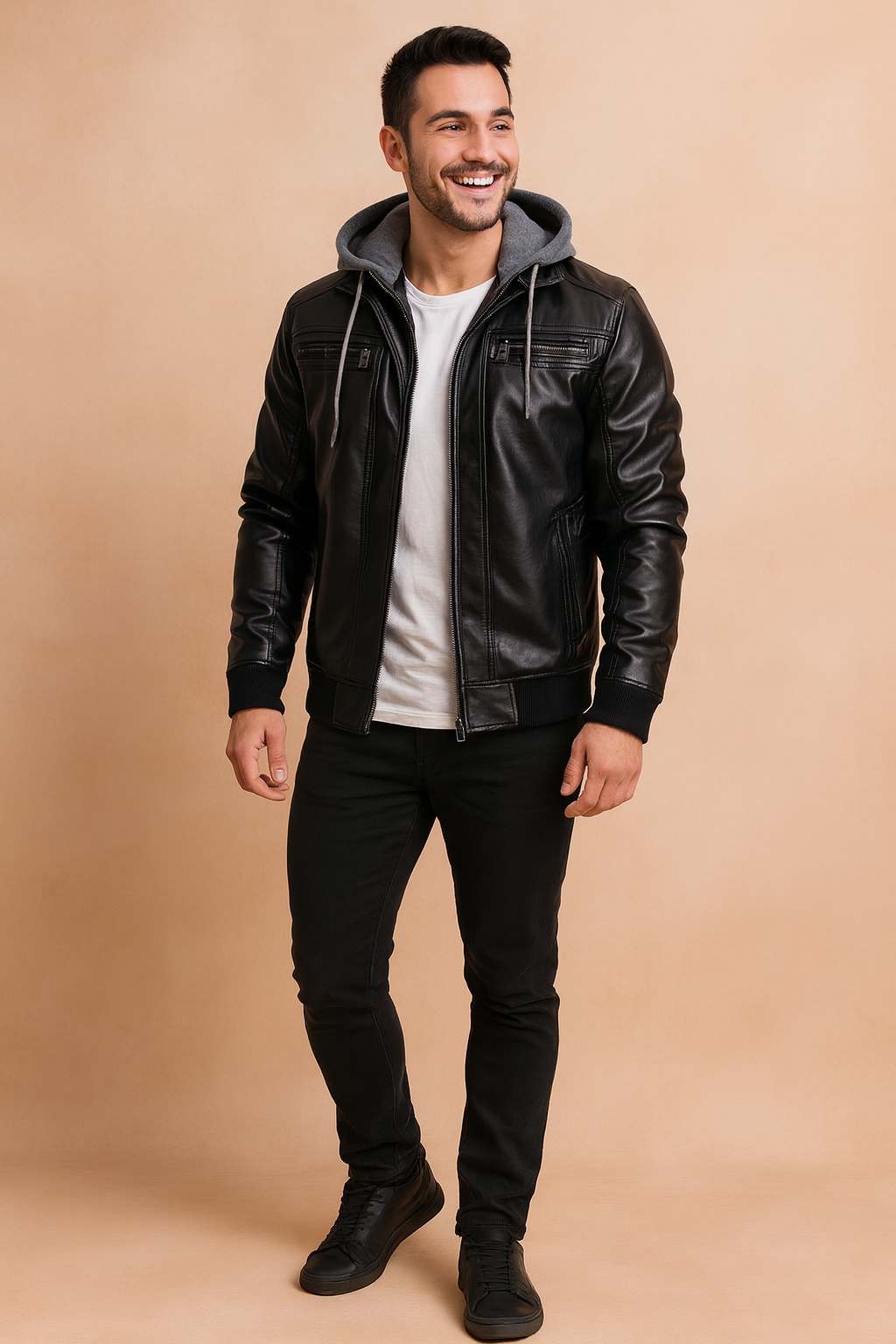 Men’s black faux leather biker jacket with ribbed cuffs, quilted chest detailing, zippered pockets, and detachable grey hood for a modern casual streetwear look.
