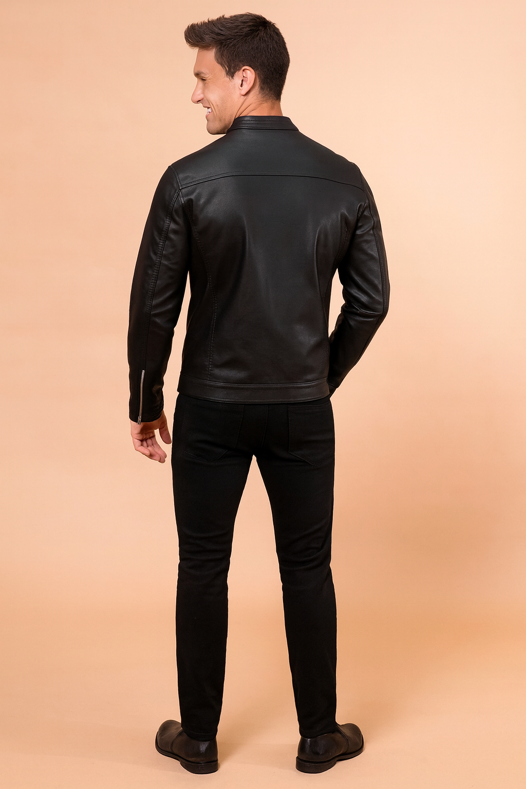 Black leather jacket with a sleek matte finish, rear panel detailing, and clean stitch lines for a modern, stylish fit.