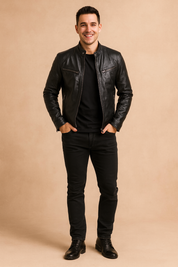 Men's black leather moto-style jacket with zippered chest and side pockets, band collar with snap button, and sleek fitted silhouette for a modern urban look.