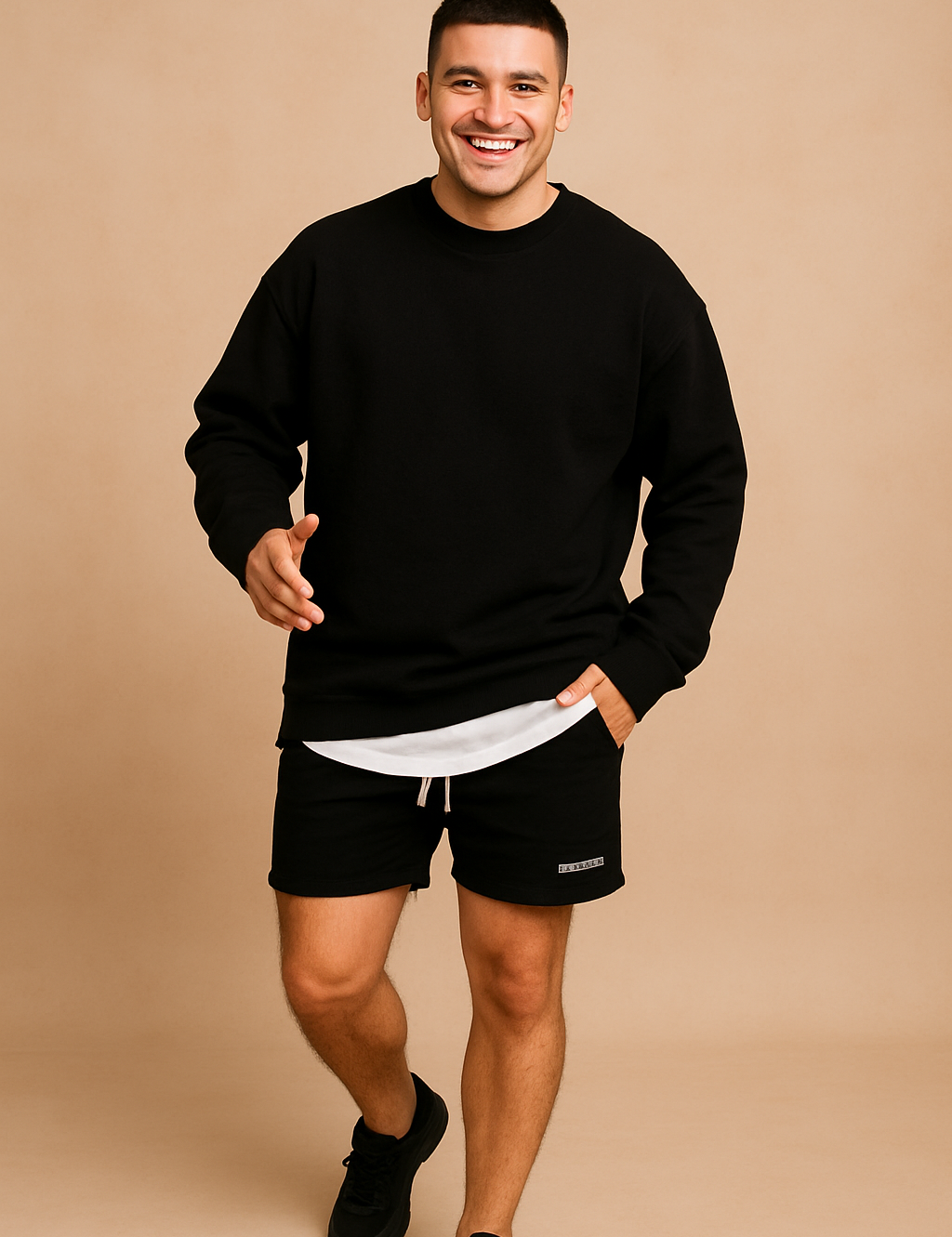 Men’s casual black long-sleeve sweatshirt paired with layered white undershirt, styled with black drawstring shorts featuring a side pocket logo print.