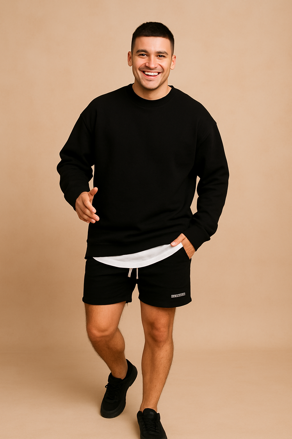 Men’s casual black long-sleeve sweatshirt paired with layered white undershirt, styled with black drawstring shorts featuring a side pocket logo print.