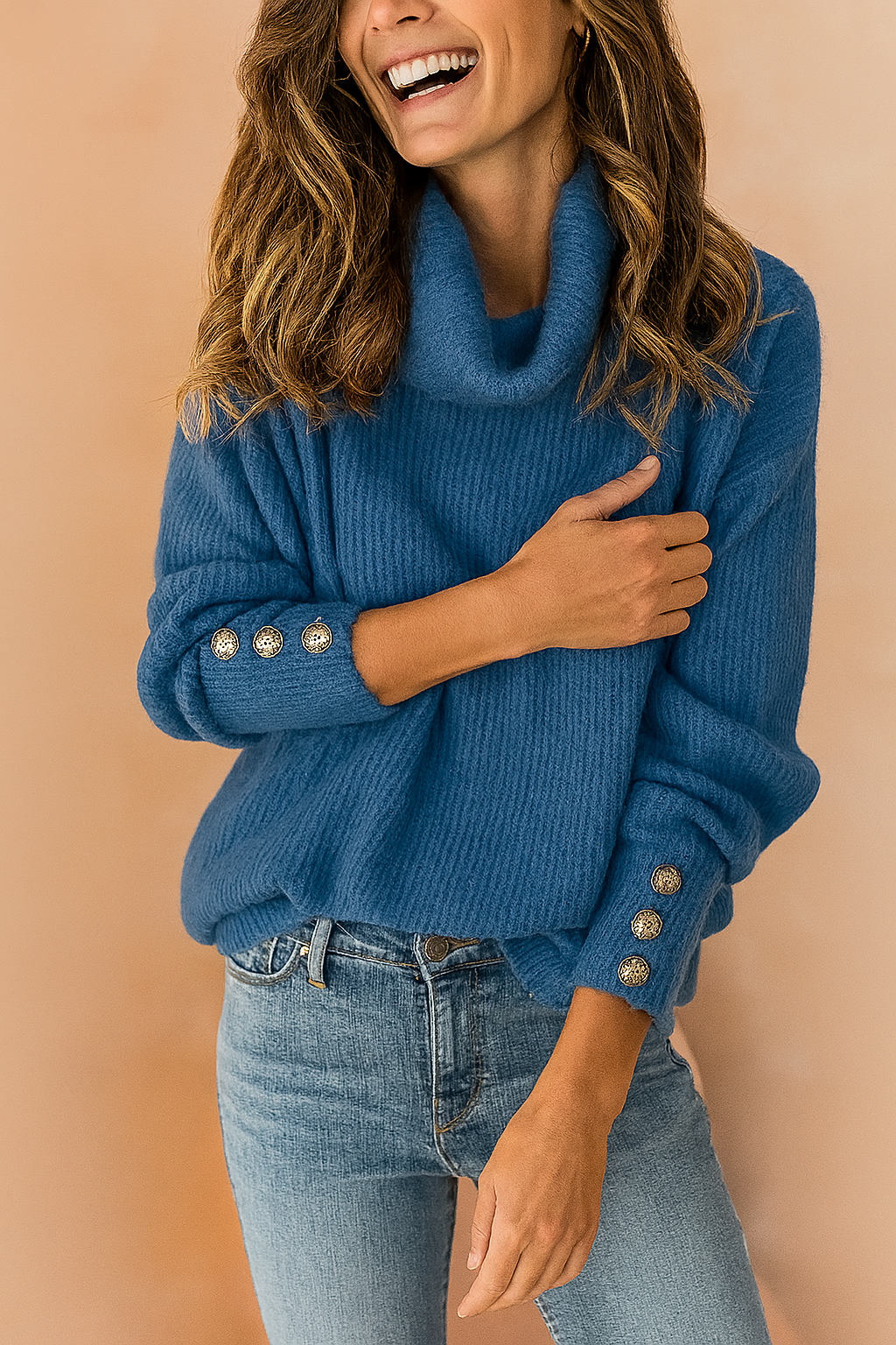 Blue ribbed knit cowl-neck sweater with decorative gold-tone buttons on the sleeves, styled with mid-rise blue denim jeans.