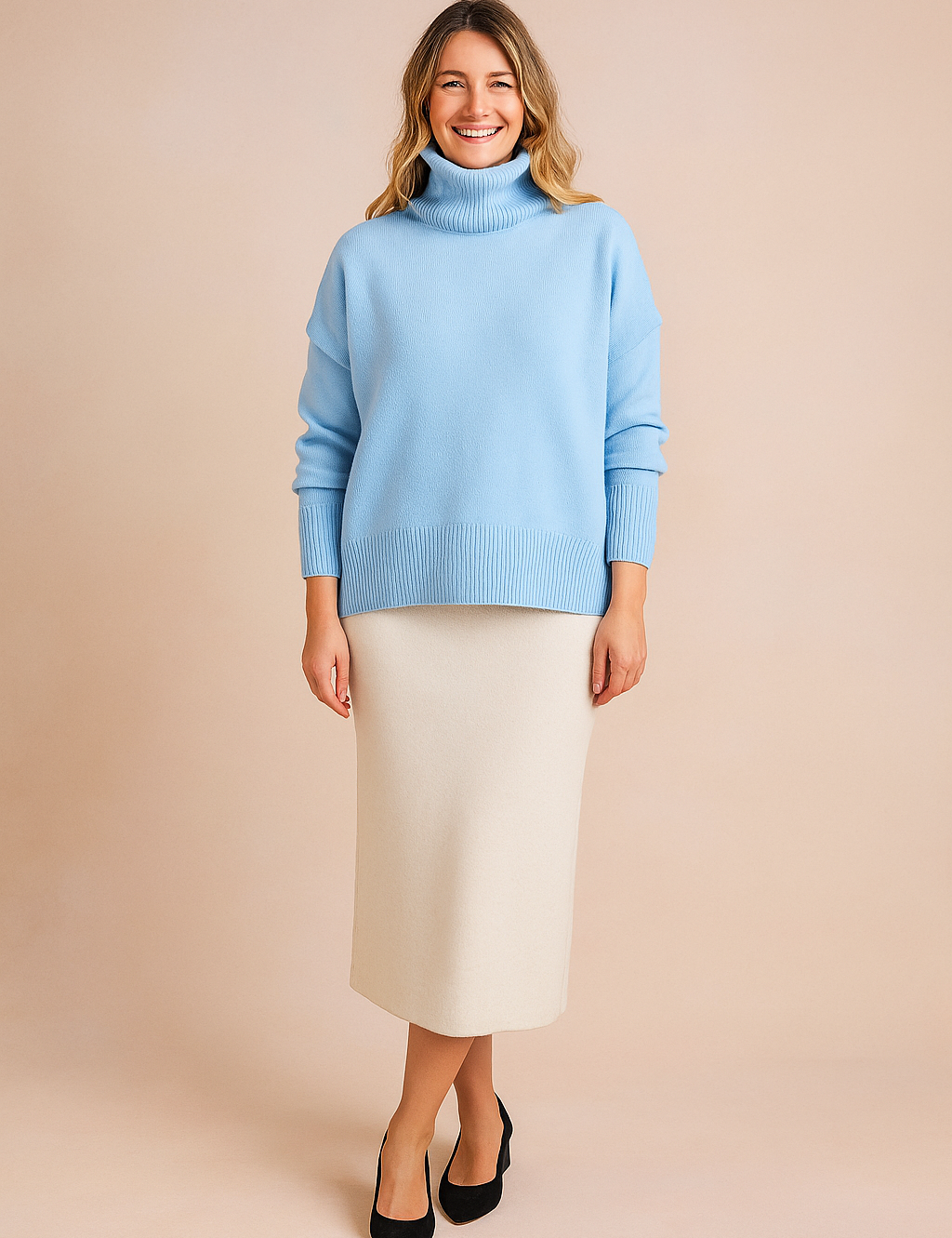 Baby blue oversized turtleneck sweater with ribbed cuffs and hem, styled with a cream midi skirt and black suede heels
