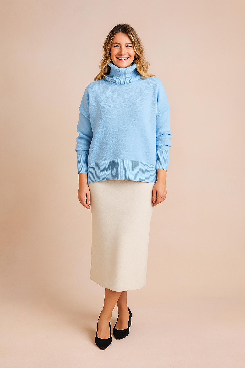 Baby blue oversized turtleneck sweater with ribbed cuffs and hem, styled with a cream midi skirt and black suede heels