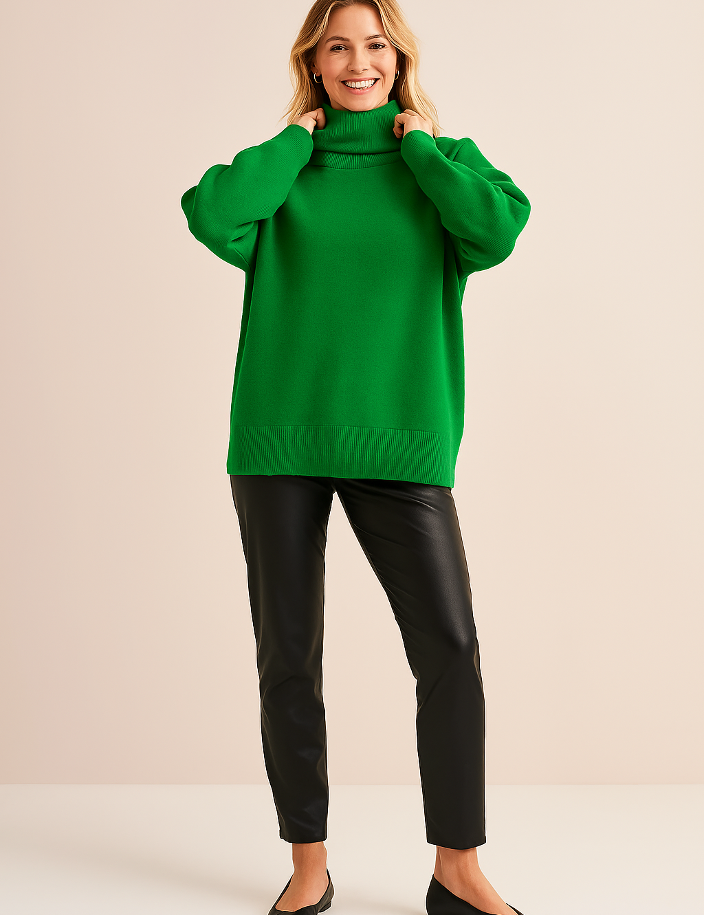 Vibrant green oversized turtleneck sweater with ribbed hem, cuffs, and collar, paired with sleek black faux leather pants and pointed black flats