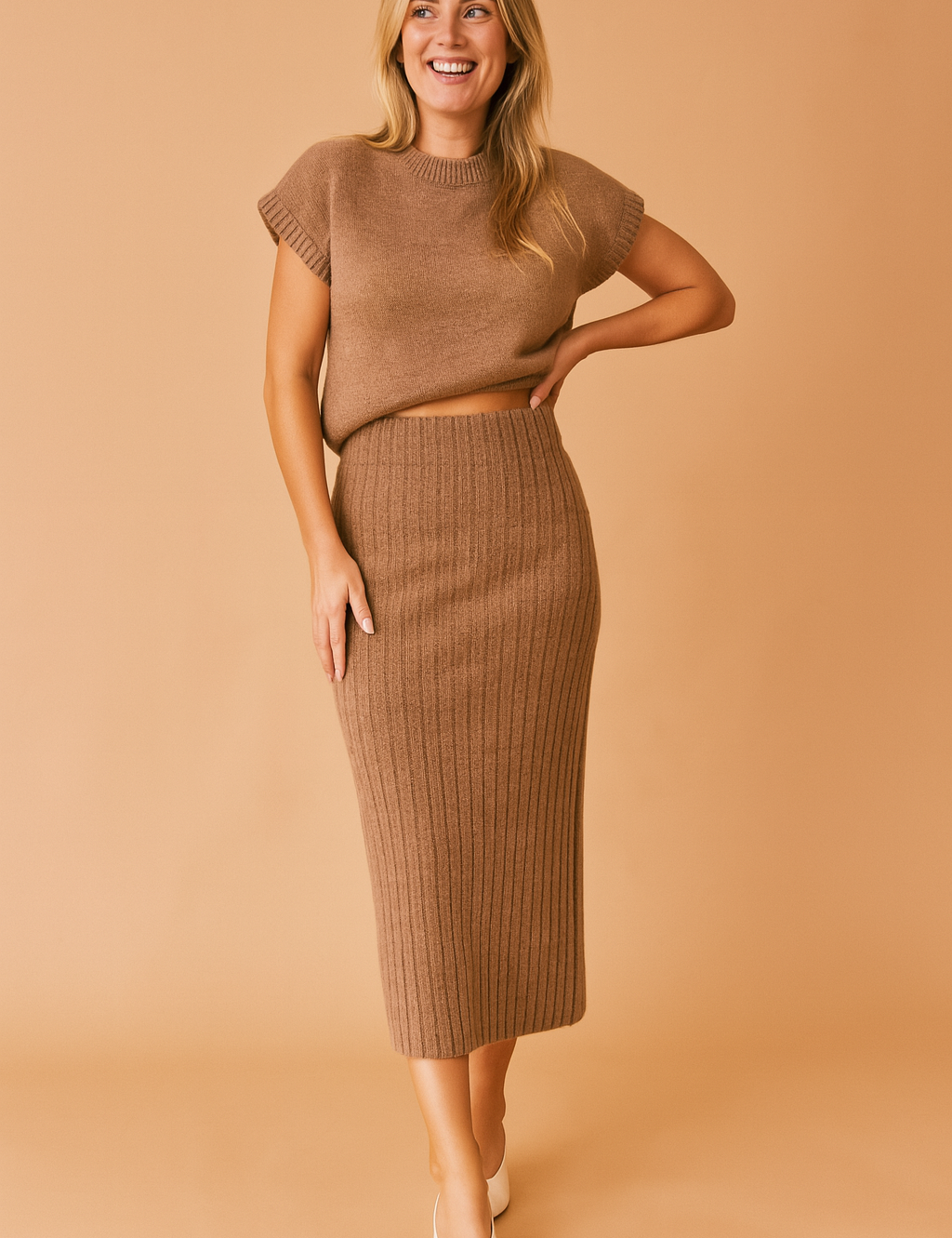 Brown ribbed knit co-ord set featuring a cap-sleeve cropped sweater and high-waisted midi pencil skirt in matching textured fabric.

