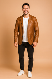 Brown leather blazer for men with a sleek tailored fit, two front flap pockets, chest pocket, and single-breasted button closure, designed for a modern and versatile look.