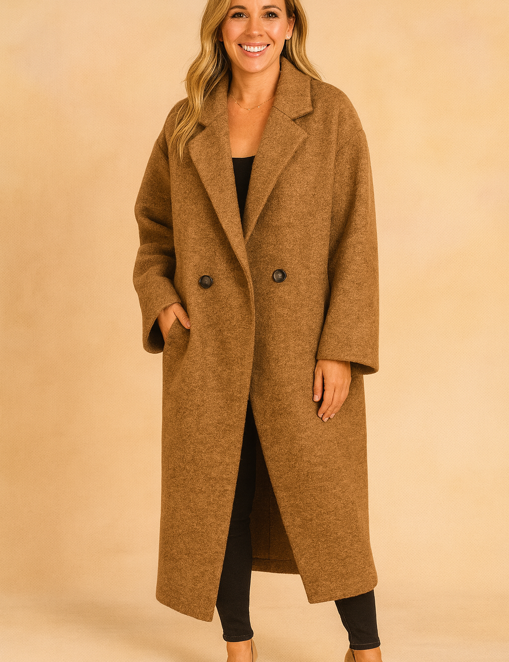 Long oversized brown double-breasted coat with wide lapels, paired with slim black pants and beige heels.
