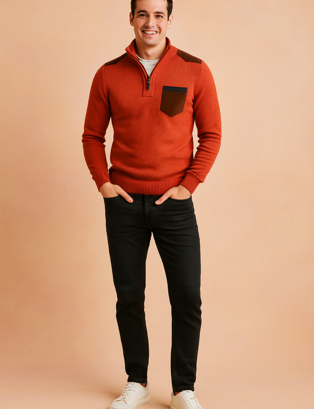 Men’s burnt orange quarter-zip sweater with brown shoulder accents and matching chest pocket detail, styled with slim-fit black jeans and white sneakers.