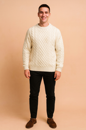 Cream white cable knit sweater featuring intricate braided and diamond patterns, styled for a cozy and classic winter look.