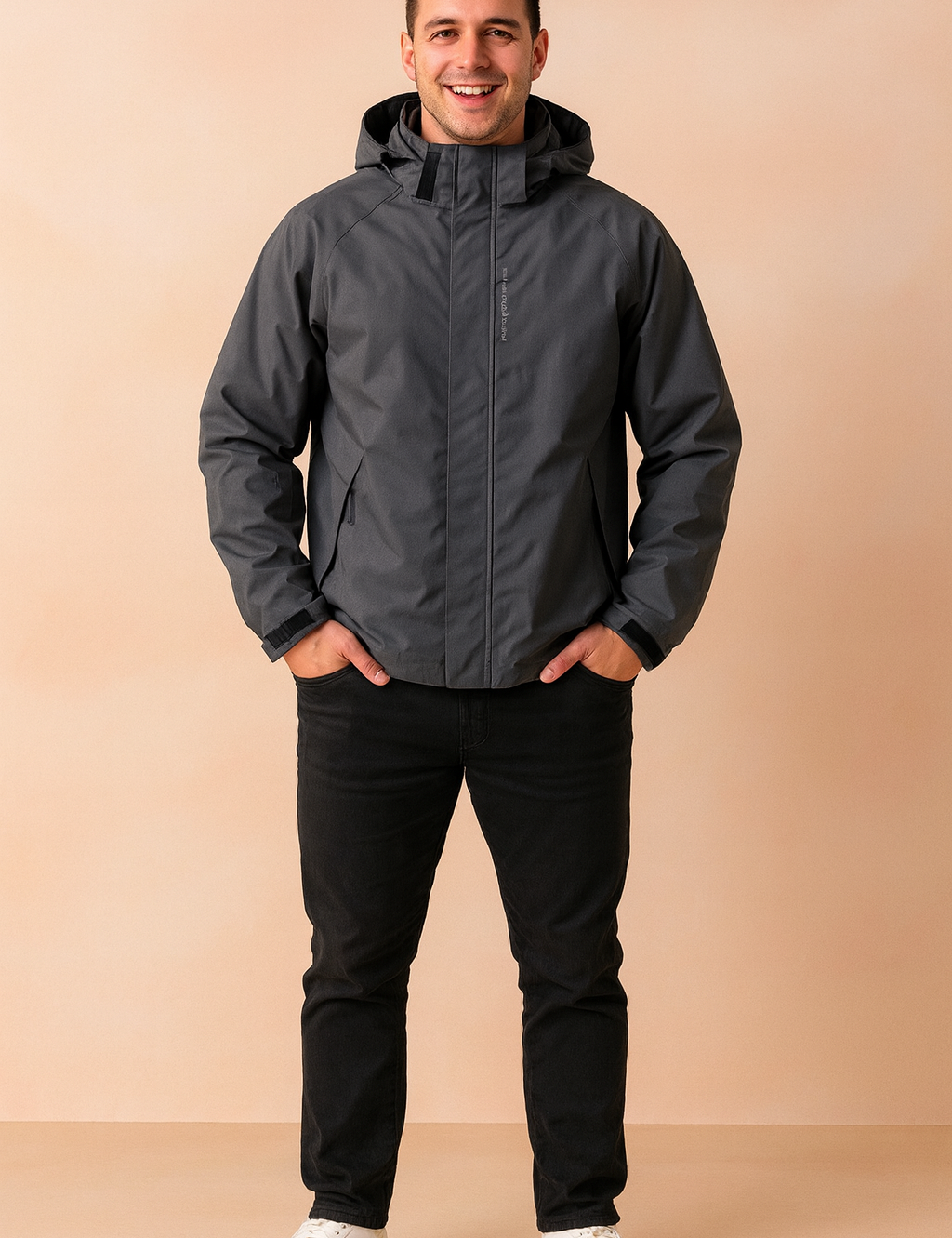 Men’s waterproof hooded windbreaker jacket in dark gray with adjustable cuffs and high-neck closure, designed for outdoor comfort and weather protection.