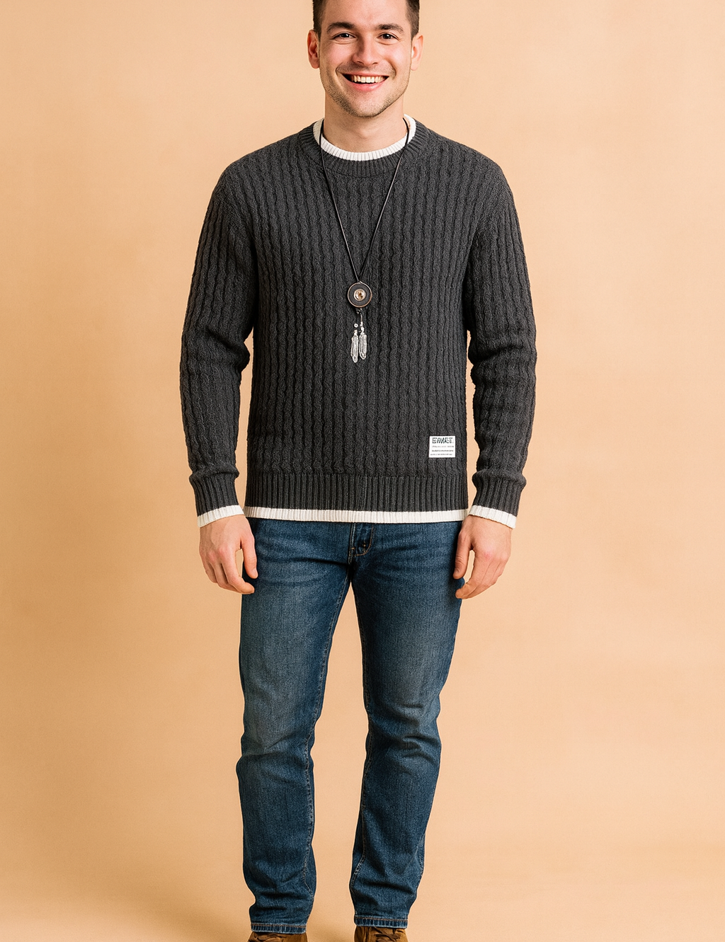 Men’s dark grey cable knit sweater with subtle wavy textured pattern, ribbed cuffs and hem, and contrasting white inner collar and sleeve detail.