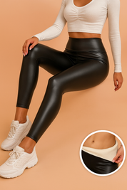 High-waisted black faux leather leggings with a fleece-lined interior, designed with a sleek matte finish and body-contouring fit.