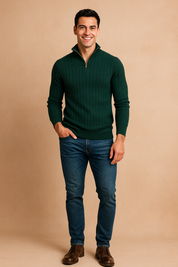 Men's forest green ribbed half-zip sweater paired with slim-fit blue jeans and brown leather boots