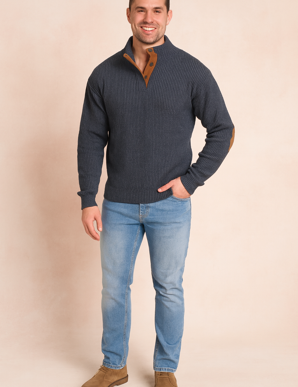 Gray ribbed pullover sweater with brown button placket and suede elbow patches, paired with light blue slim-fit jeans and brown suede shoes.