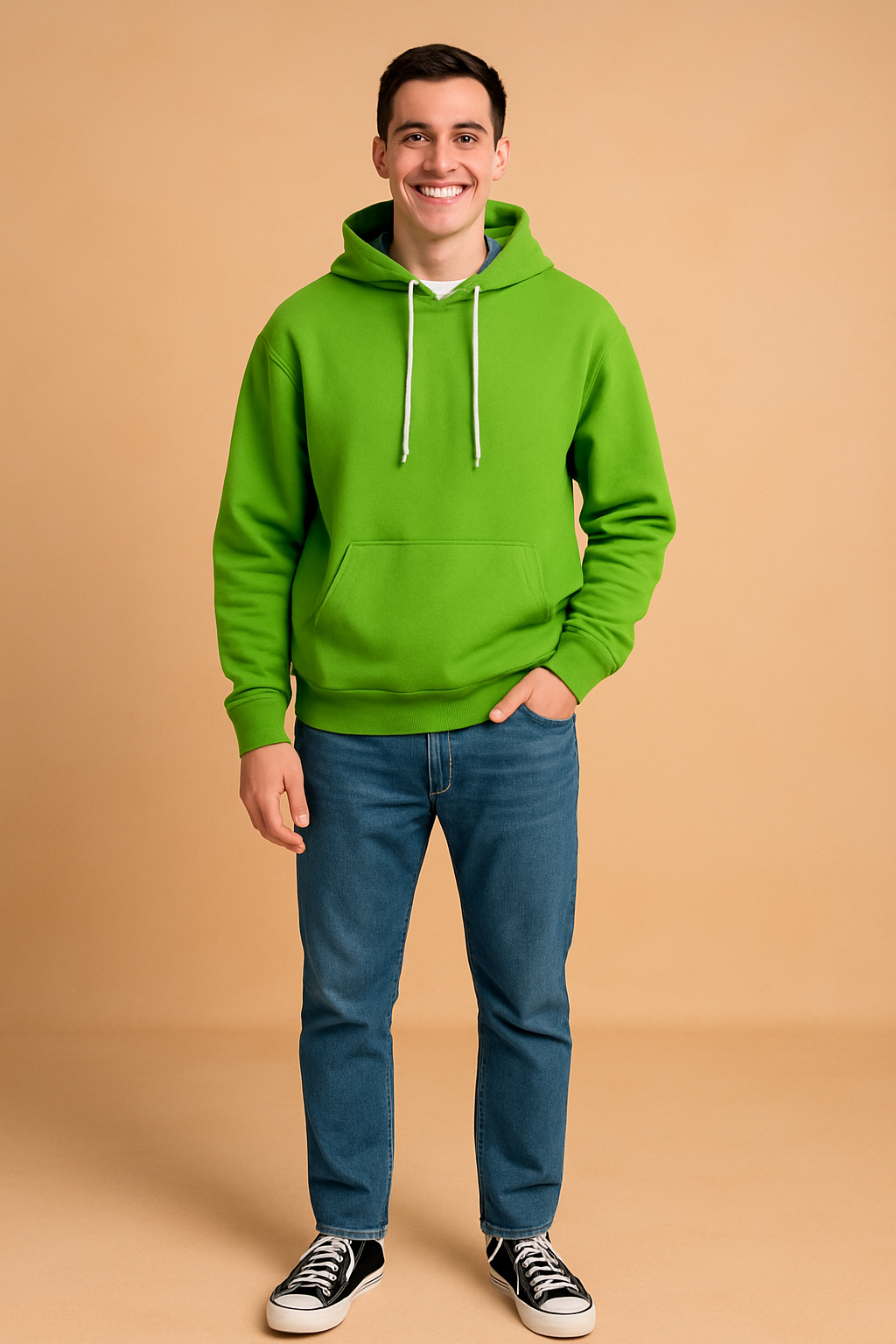 Green hoodie with front kangaroo pocket and white drawstrings, paired with blue jeans and black sneakers