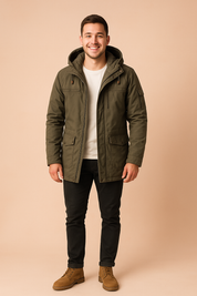 Men’s hooded parka jacket color green with front zipper, chest pockets, and adjustable drawstrings, paired with slim black pants and tan boots for a casual outdoor look.