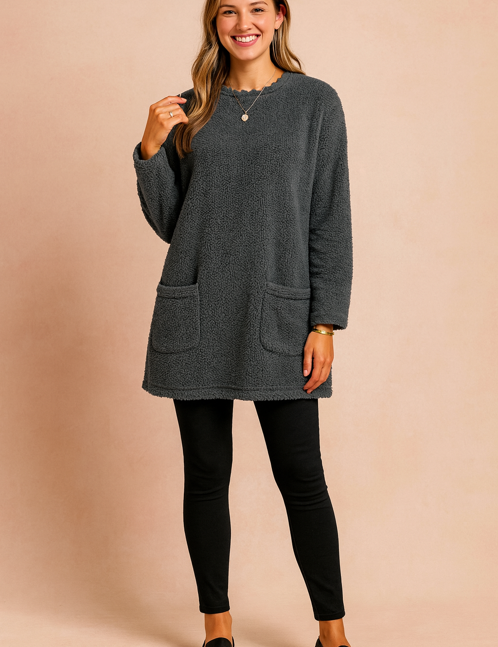 Long oversized sweater with a fluffy, plush texture, featuring two practical front pockets and a simple, comfortable fit.