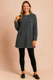 Long oversized sweater with a fluffy, plush texture, featuring two practical front pockets and a simple, comfortable fit.