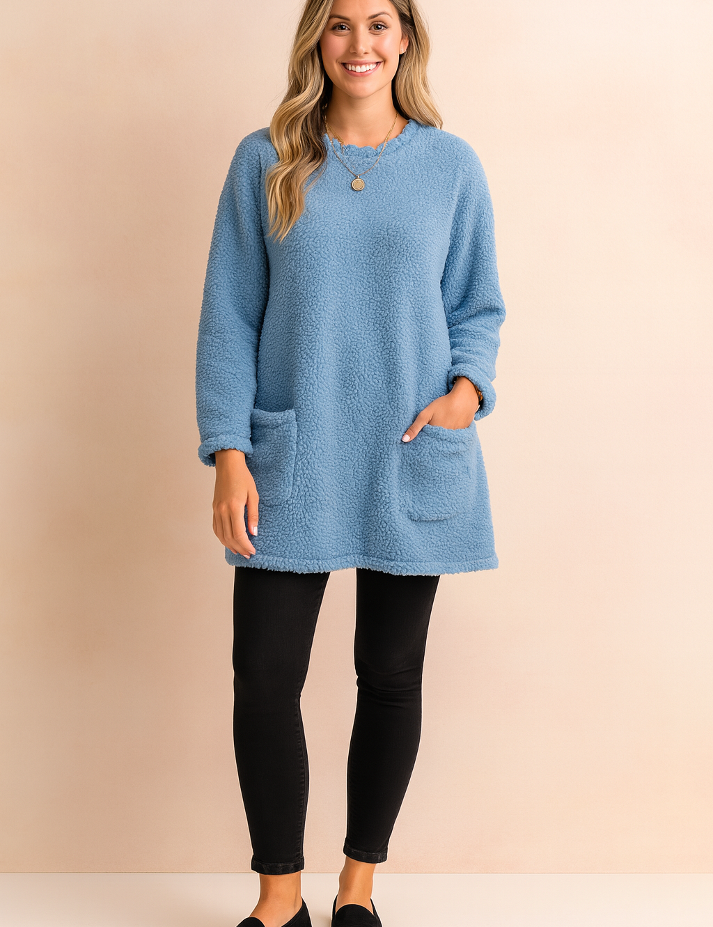 Long oversized sweater with a fluffy, plush texture, featuring two practical front pockets and a simple, comfortable fit.