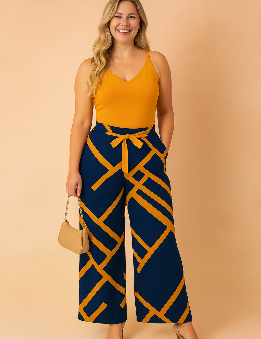 Sleeveless mustard top paired with high-waisted navy wide-leg pants featuring bold mustard geometric stripes and a centered mustard waist tie.