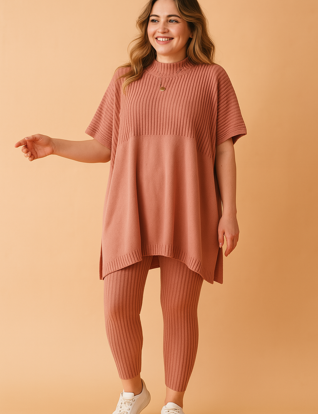  Ribbed knit co-ord set featuring an oversized tunic top and matching fitted leggings in a vintage old rose tone, styled with a high neckline and short sleeves.