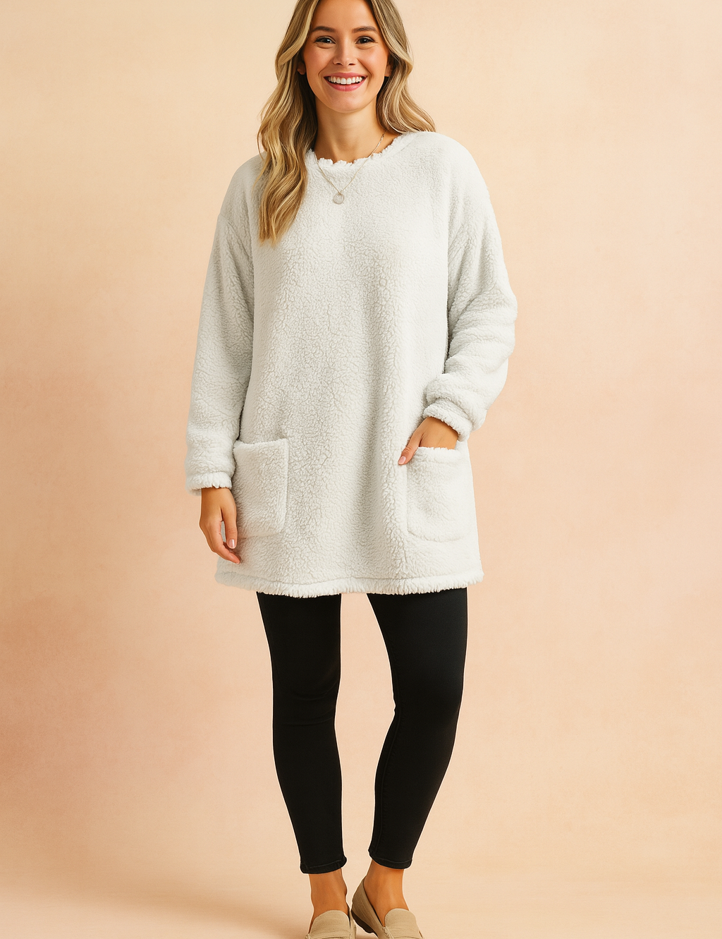 Long oversized sweater with a fluffy, plush texture, featuring two practical front pockets and a simple, comfortable fit.