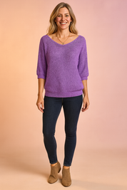 Lavender textured knit pullover with half sleeves, wide neckline, and ribbed hem, styled with dark skinny jeans and tan ankle boots.
