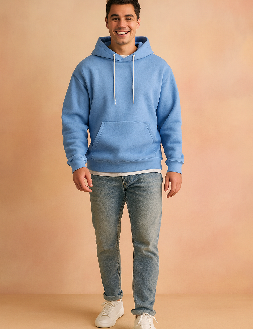 Men’s light blue pullover hoodie with front kangaroo pocket and white drawstrings, styled with light blue jeans and white sneakers.
