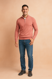 Light red zip-neck sweater with subtle ribbed knit texture, styled with classic blue denim jeans and casual dark sneakers.