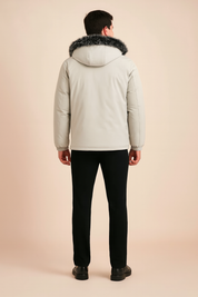 Men’s winter parka in light gray with faux fur-trimmed hood, straight cut back, long sleeves, and subtle seam detailing for a sleek cold-weather look.