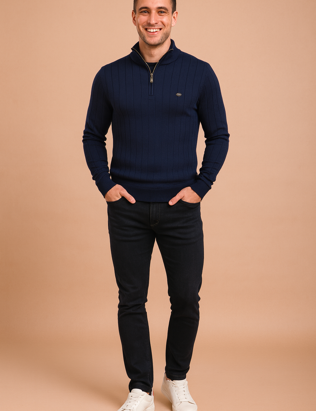 Men’s navy ribbed quarter-zip sweater with vertical textured patterns, styled with slim-fit dark jeans and white sneakers.