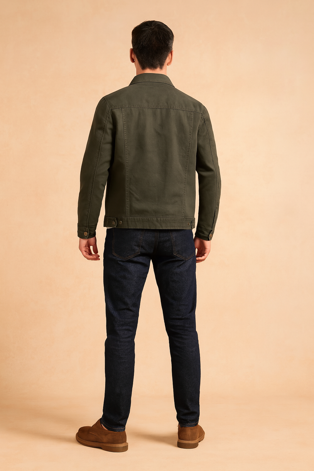 Men’s olive green denim jacket with structured seams, buttoned cuffs, adjustable hem tabs, and a straight tailored fit, designed for a casual yet rugged look.