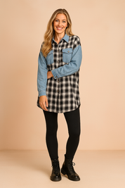 Oversized black and white plaid shirt with denim sleeves and front flap pocket, styled with black leggings and lace-up combat boots.