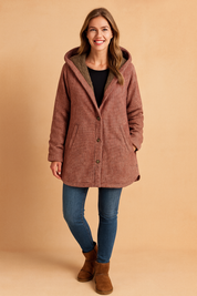 A warm-toned plaid hooded coat with a soft fleece lining, front button closure, and side pockets, designed for casual winter wear.