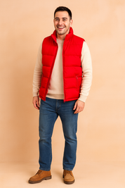 Men’s red puffer vest with front zipper, horizontal quilted design, and dual zippered pockets, styled for casual winter wear.