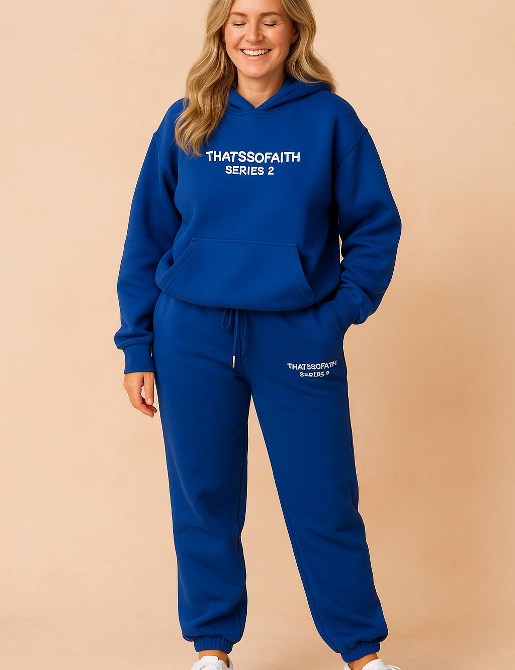 Bold royal blue hoodie and jogger pants co-ord set with white “THATSSOFAITH SERIES 2” prints, relaxed fit, elastic hems, and paired with classic white sneakers.